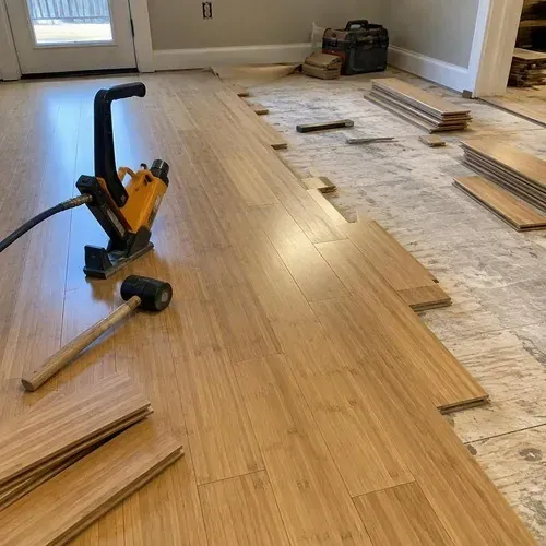 Bamboo floor planks nailed down showing the natural grain striations