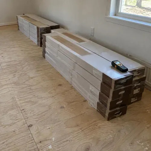 Moisture meter check on flooring before installation, part of our standards