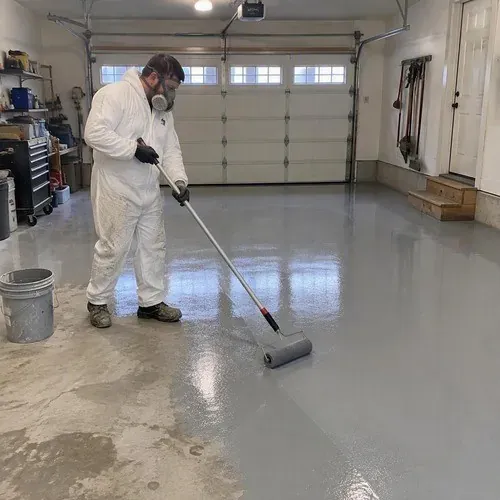 Epoxy coating rolled onto a workshop floor, a common Wellesley Township project