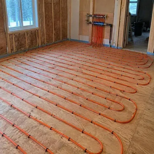Hydronic radiant floor heating tubing laid before flooring in a custom home