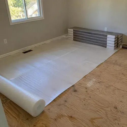 Laminate flooring cartons and foam underlayment ready for installation