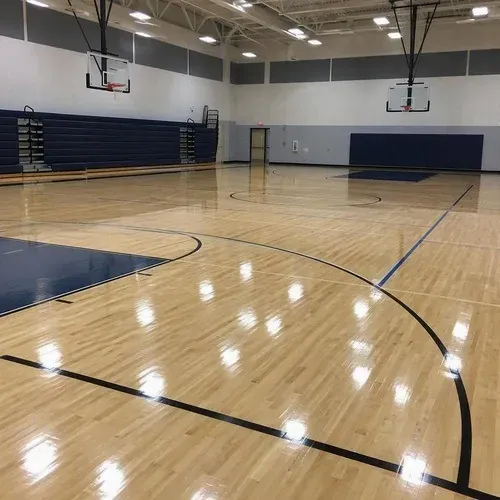 Finished gymnasium sports floor with painted game lines