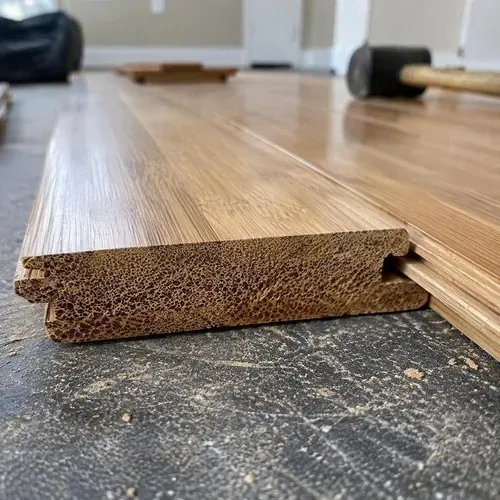 Strand-woven bamboo flooring end grain and click-lock profile close-up