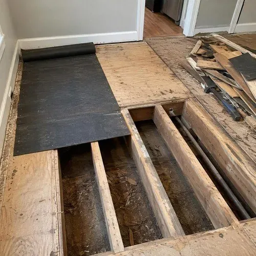 Century home floor opened to the joists for subfloor repair in Cambridge